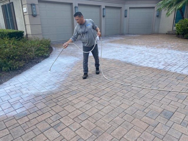 Guy paver sealing driveway